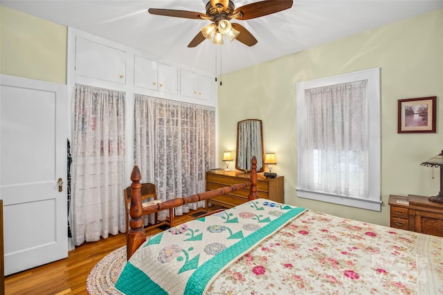 bedroom with ceiling fan and light hardwood / wood-style floors