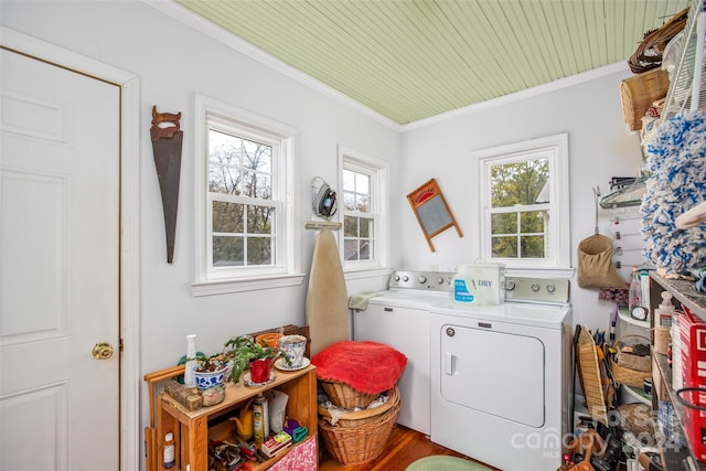 laundry area with wooden ceiling, wood-type flooring, separate washer and dryer, and crown molding