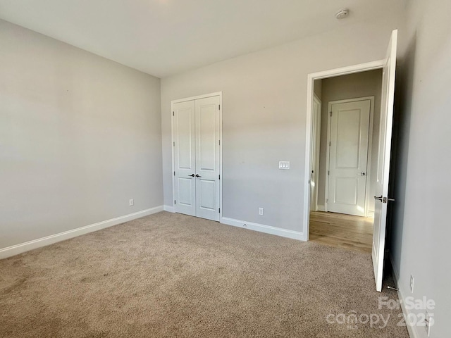 405 Northgate Blvd, Indian Trail, NC 28079 - unfurnished bedroom with carpet flooring, baseboards, and a closet