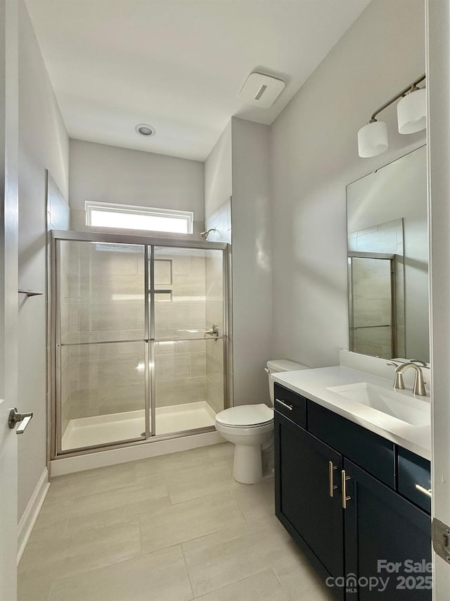 405 Northgate Blvd, Indian Trail, NC 28079 - bathroom featuring toilet, vanity, tile patterned flooring, and a stall shower
