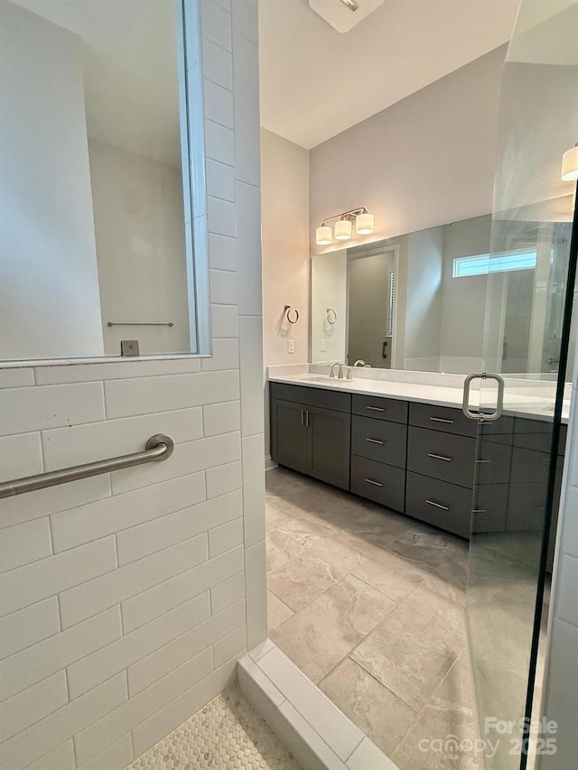 405 Northgate Blvd, Indian Trail, NC 28079 - bathroom with vanity, a shower, and tile walls