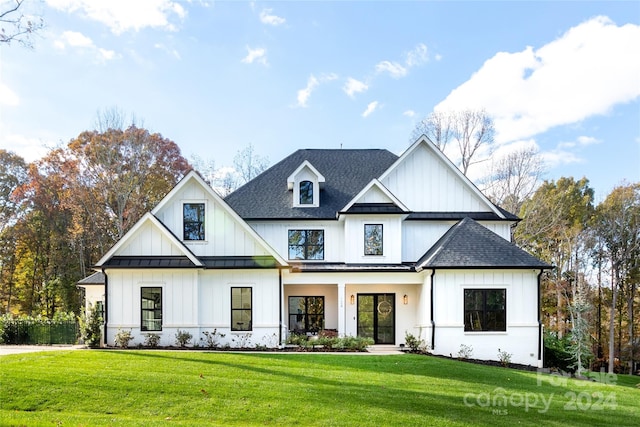 modern inspired farmhouse featuring a porch and a front lawn