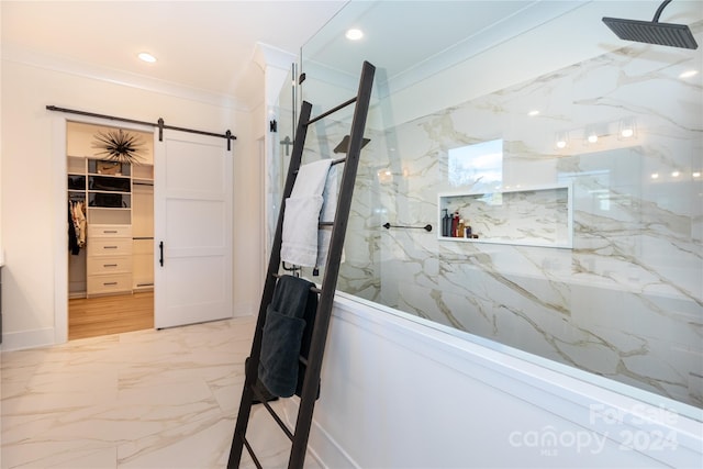 bathroom featuring crown molding and tiled shower