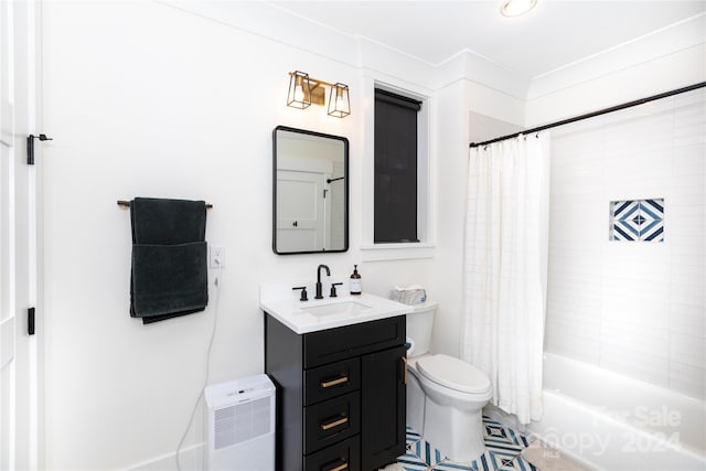 full bathroom with tile patterned floors, vanity, toilet, and shower / bath combo with shower curtain