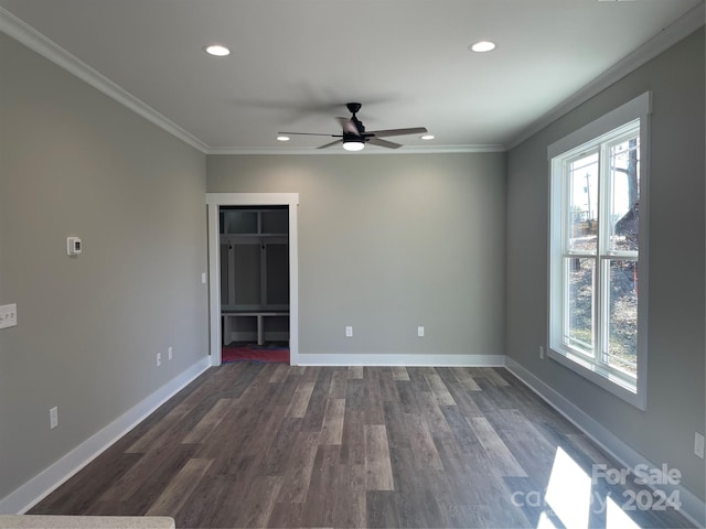 unfurnished bedroom with a closet, dark hardwood / wood-style floors, multiple windows, and ceiling fan