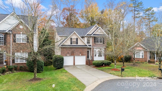 view of front of property with a garage and a front lawn