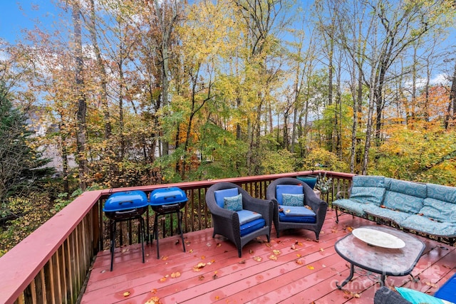 wooden deck with an outdoor living space