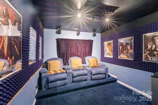 carpeted cinema with baseboards