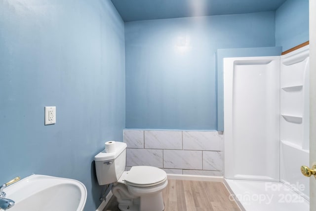 bathroom featuring toilet and wood finished floors