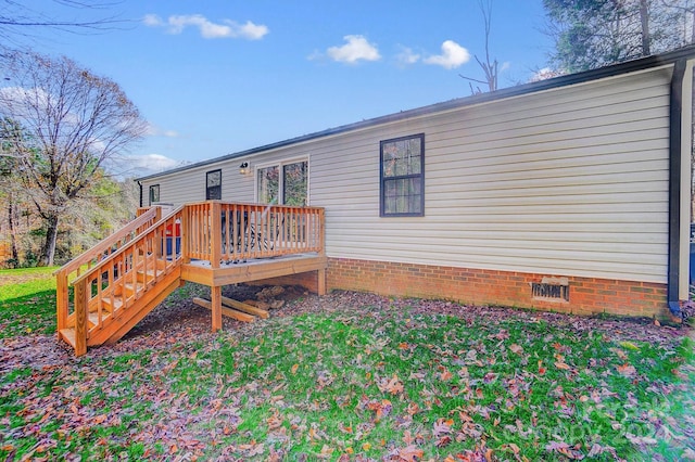 back of property featuring a deck