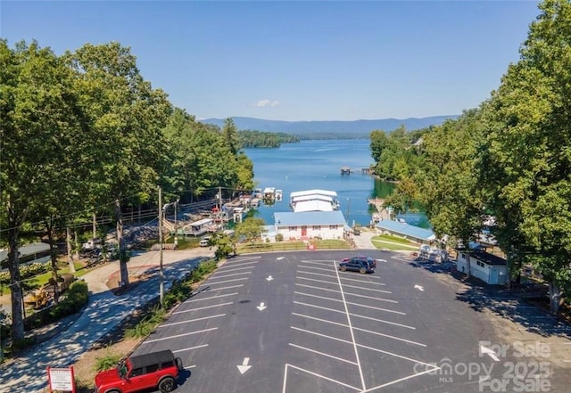 exterior space featuring a water and mountain view