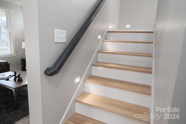 stairs with wood-type flooring