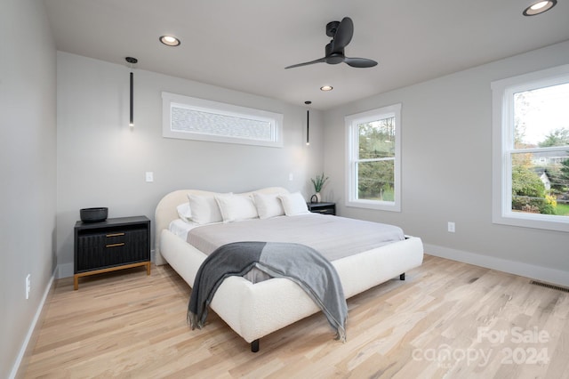 bedroom featuring ceiling fan and light wood-type flooring