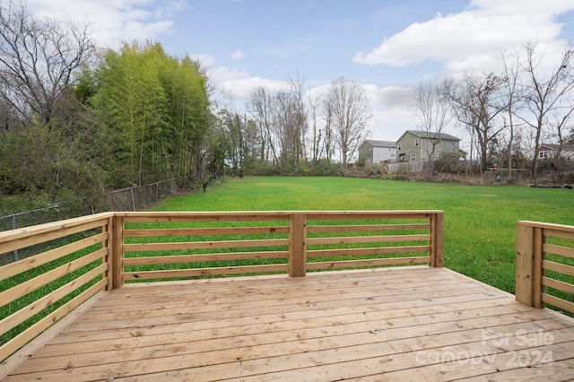 wooden terrace with a yard