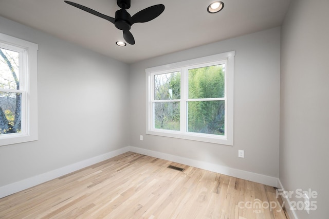 empty room with light hardwood / wood-style floors and ceiling fan