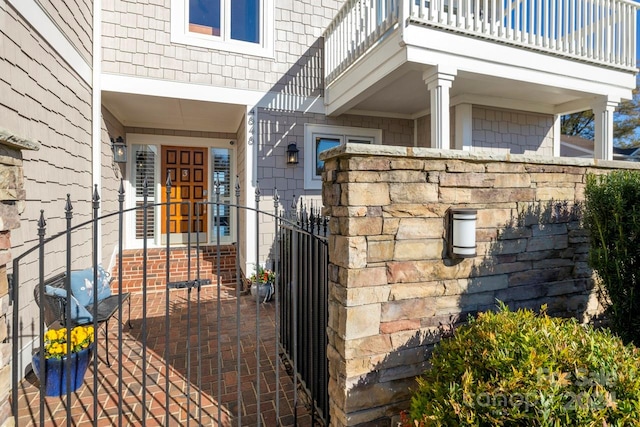 entrance to property featuring a balcony