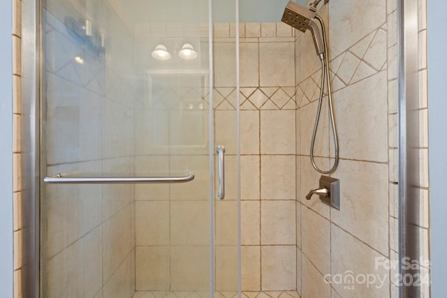 bathroom with an enclosed shower