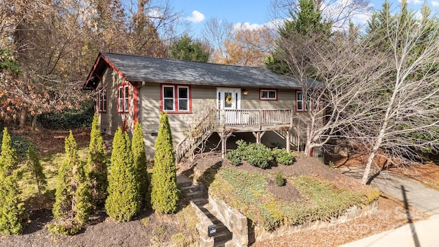 rear view of house with a wooden deck