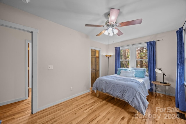 bedroom featuring ceiling fan and light hardwood / wood-style flooring