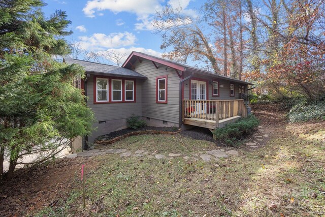 view of side of home featuring a deck