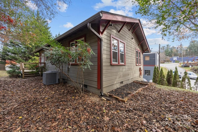 view of side of home featuring central air condition unit