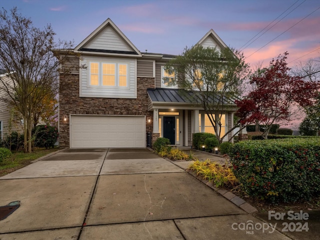 view of front of property featuring a garage