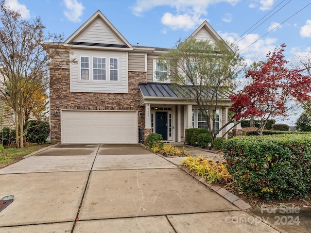 view of front of property featuring a garage