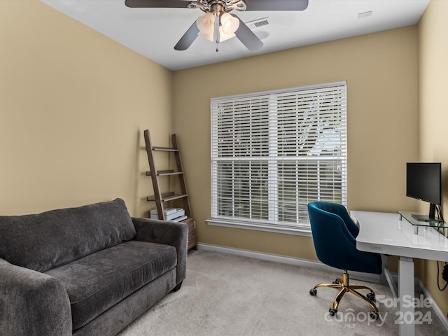 office featuring ceiling fan and light colored carpet