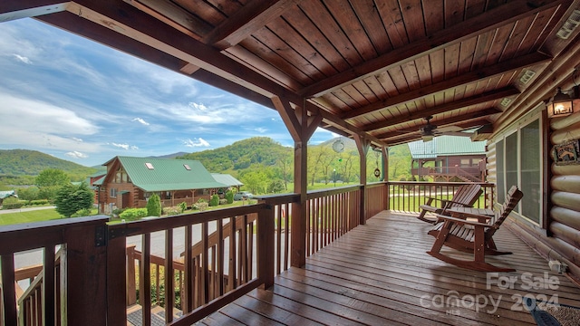 deck with ceiling fan and a mountain view