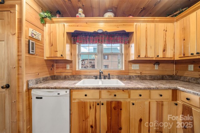 kitchen with light brown cabinetry, sink, wooden ceiling, and dishwasher