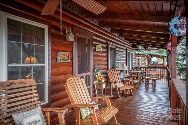 wooden terrace featuring a porch