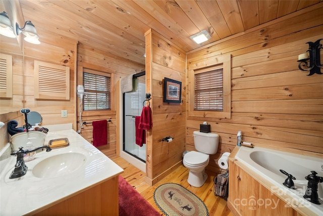 full bathroom with wood ceiling, hardwood / wood-style flooring, wooden walls, vanity, and separate shower and tub