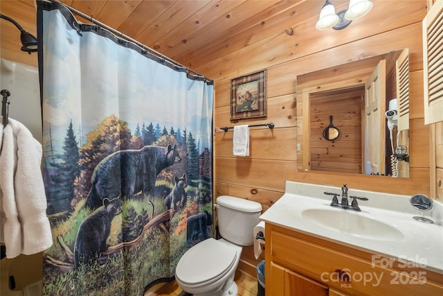 bathroom featuring vanity, wood ceiling, toilet, and wood walls