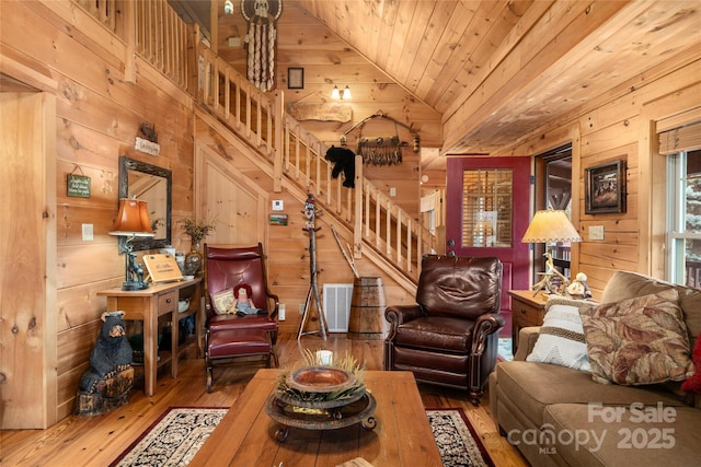 living room featuring wood ceiling, vaulted ceiling, hardwood / wood-style flooring, and wood walls