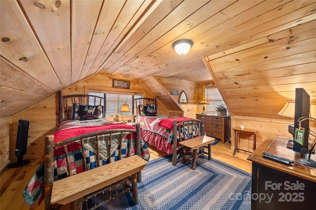 bedroom with multiple windows, wood ceiling, hardwood / wood-style flooring, and wood walls