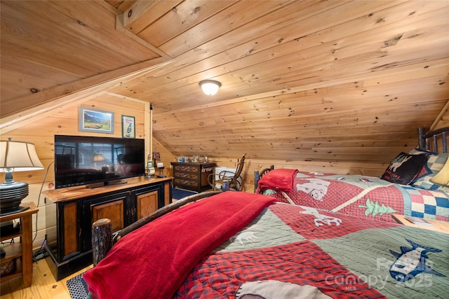 bedroom with wood-type flooring, lofted ceiling, wooden ceiling, and wood walls