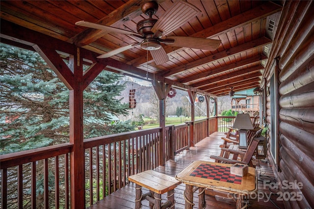 wooden deck with ceiling fan