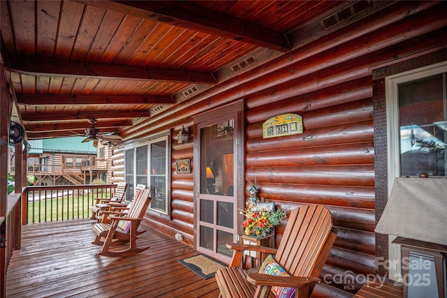 wooden deck with a porch and ceiling fan