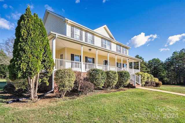 view of front of property with a porch and a front yard