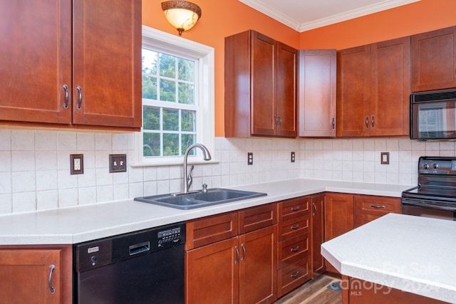 kitchen featuring sink, tasteful backsplash, light hardwood / wood-style flooring, crown molding, and black appliances