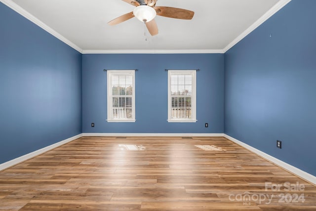 spare room featuring ceiling fan, wood-type flooring, and ornamental molding