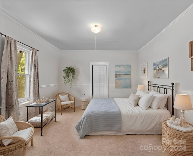 carpeted bedroom with ornamental molding