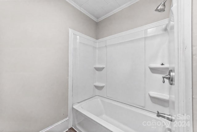 bathroom featuring shower / bath combination and ornamental molding