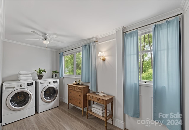 washroom featuring ceiling fan, washing machine and dryer, a wealth of natural light, and light hardwood / wood-style flooring