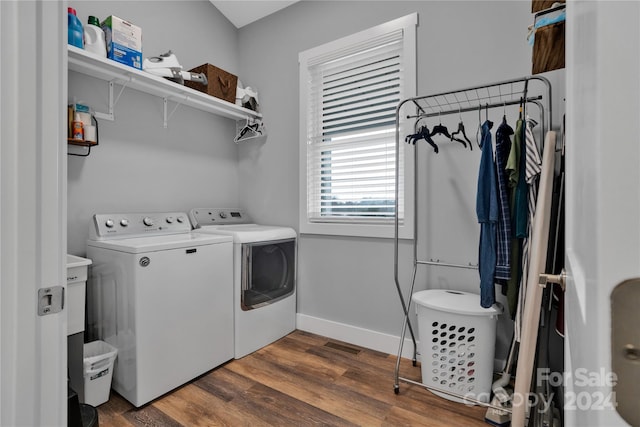 washroom featuring washer and dryer and dark wood-type flooring