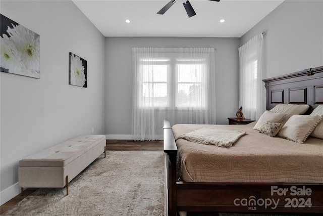 bedroom with ceiling fan and hardwood / wood-style floors