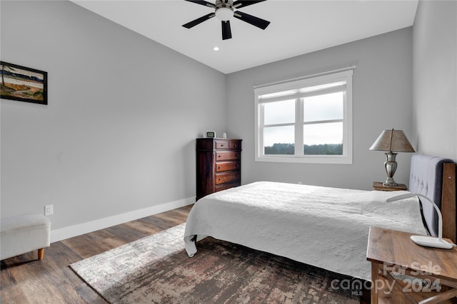 bedroom featuring dark hardwood / wood-style floors and ceiling fan