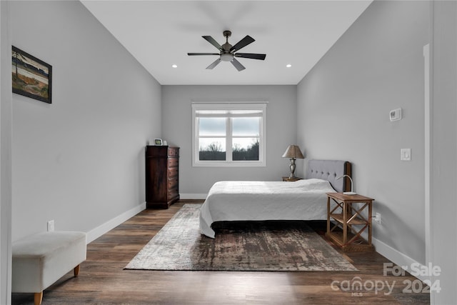 bedroom featuring ceiling fan and dark hardwood / wood-style flooring