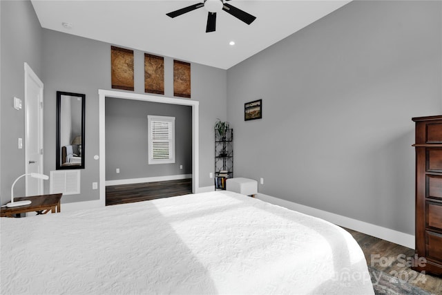 bedroom with ceiling fan and dark hardwood / wood-style flooring