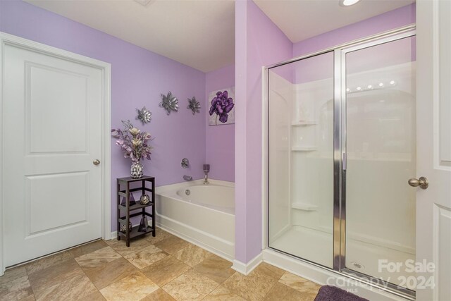 bathroom with separate shower and tub